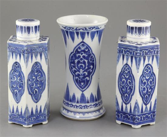 A pair of Chinese blue and white hexagonal jars and covers and a similar beaker vase